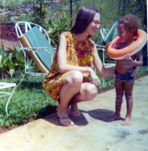 Ekemba learning to swim with his mom, an early moment connected to fascia stress relief for mothers.