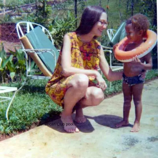 Ekemba learning to swim with his mom, an early moment connected to fascia stress relief for mothers.
